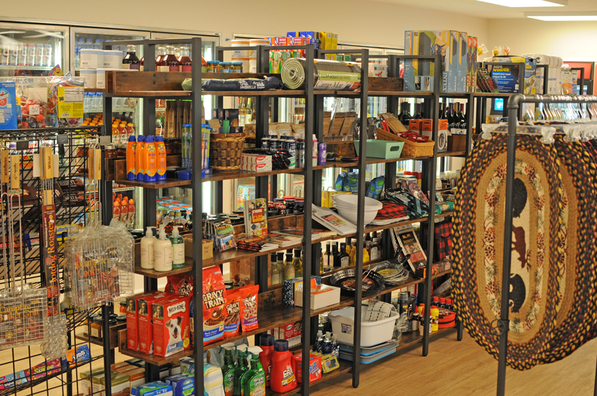 An image of shelving with a variety of camping and RV essential items.